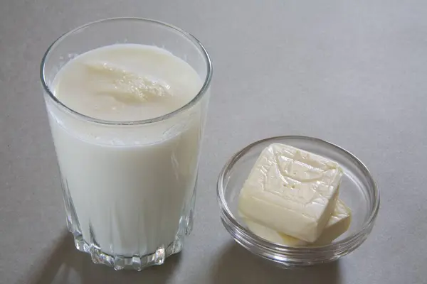 Full glass of milk and cheese made from milk dairy product , India