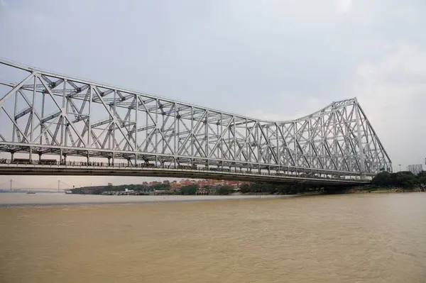 View of Howrah Bridge now Rabindra Setu over River Hooghly ; Calcutta Kolkata ; West Bengal ; India