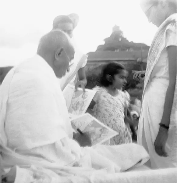 stock image Mahatma Gandhi giving an autograph on his 75th birthday at Pune, Maharashtra, India, October 2, 1944  