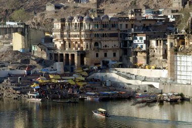 Ghat on the river of Narmada at Omkareshwar, District Khandva, Madhya Pradesh, India clipart