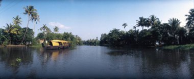 Panaromic Landscape Of Kerala With House Boat , Coconut Trees And Water At Allepey , Kerala , India clipart