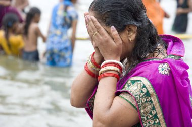 Woman bathing in river, Nasik, maharashtra, india, asia  clipart