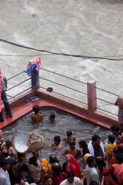Devotees having hot water spring Uttarakhand India Asia  clipart