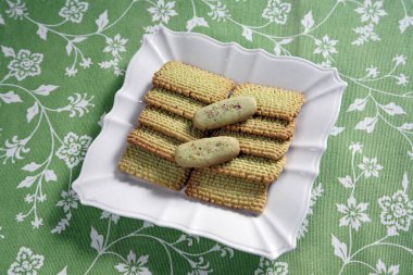 Pistachio Biscuits in white plate clipart