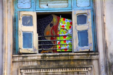 Window and cloth hanging in chawl ; Lower Parel ; Bombay Mumbai ; Maharashtra ; India 26-August-2009 clipart