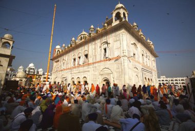 Celebrations of 300th year of consecration of perpetual Guru Granth Sahib Sikh, devotees praying at Sachkhand Saheb Gurudwara in Nanded, Maharashtra, India  clipart