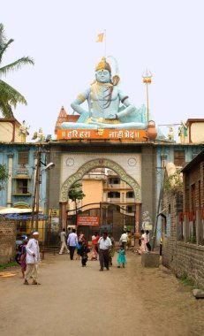 Statue of shiva and vitthala on gate of dharmashala at, Pandharpur, district Solapur, Maharashtra, India  clipart