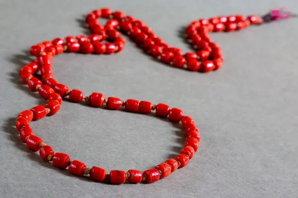 stock image Gemstone moonga praval coral chanting prayer beads considered as holy spiritual on gar background