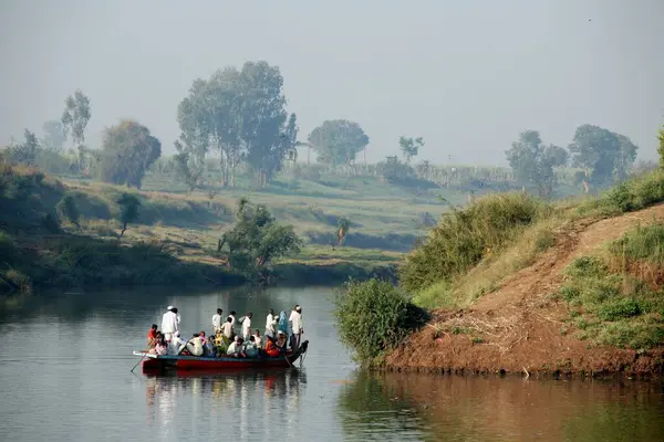stock image People from Haripur village use a boat to cross river Krishna in Sangli district ;  Maharashtra ; India