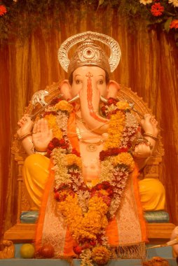 Idol of Lord Ganesh ; worshiping for Ganapati festival ; elephant headed god of Hindu ; Pune ; Maharashtra ; India clipart