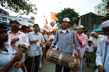 Varkari celebrating ekadashi on road, Wadala, Maharashtra, India  clipart