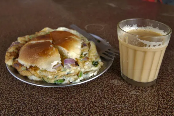 stock image Breakfast omelette and bread with masala tea ; Dehradun ; Uttaranchal ; India