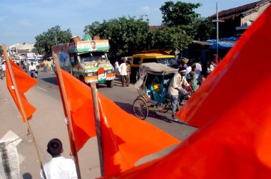 A Congress candidates vehicle passing by the Shiv Sena candidates vehicle during the election campaign in the Chimur constituency of Chandrapur district, Nagpur, Maharashtra, India  clipart
