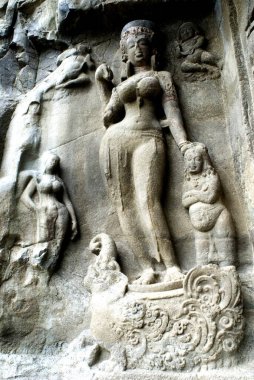Statue carved on wall in Ellora caves ; Aurangabad ; Maharashtra ; India clipart