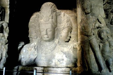 Tri murti or three headed God Shiva statue at Elephanta caves ; Maharashtra ; India clipart