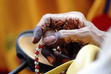 Dawoodi Bohra muslim lady chanting using rosary clipart