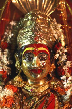 Fully decorated bronze statue of goddess Yellama with turmeric and ; kumkum ; wedding of eunuchs on occasion of Bewa Purnima at Ghatkopar ; Bombay now Mumbai ; Maharashtra ; India clipart