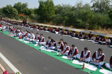 Girls sitting on road, jodhpur, rajasthan, india, asia  clipart