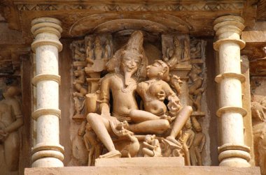 statues at chitragupta temple , khajuraho , madhya pradesh , india clipart