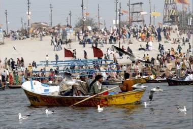 Boats or ferries on the banks of Ganges during the Ardh Kumbh Mela, one of the worlds largest religious festivals at Allahabad, Uttar Pradesh, India  clipart