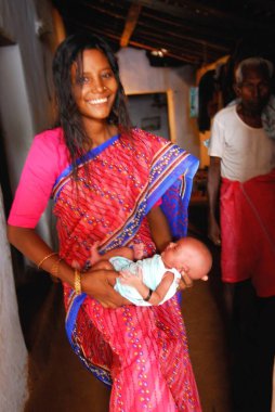 Ho tribes mother with baby, Chakradharpur, Jharkhand, India   clipart