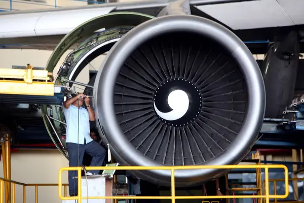 stock image An engineer working on Boeing 747-400 parked for maintenance and repair at the hanger based in Chhatrapati Shivaji International Airport or Sahar International Airport, Bombay Mumbai, Maharashtra, India 