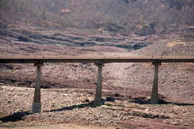 Road bridge over dried river in Khandwa, Madhya Pradesh, India   clipart