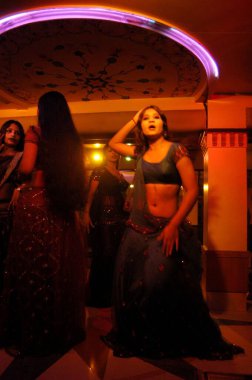 Decked up girls dancing in bar, Bombay Mumbai, Maharashtra, India  clipart