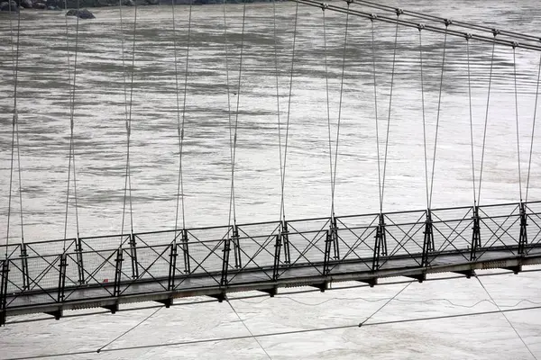 stock image Close view of Lakshman jhula over Ganga River at Rishikesh, Uttaranchal, India 