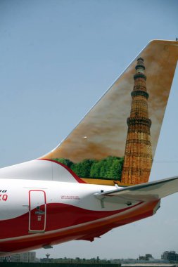 An Air-India Express flight a low cost airline subsidiary of Air India based in Chhatrapati Shivaji International Airport or Sahar International Airport, Bombay Mumbai, Maharashtra, India  clipart