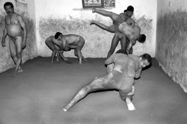 Men practicing Nada kushti  ; traditional Indian wrestling ; Mysore ; Karnataka ; India clipart