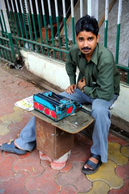 Man with typewriter, Bombay Mumbai, Maharashtra, India   clipart
