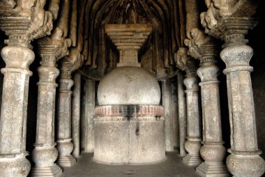 Richly stone carved stupa and pillars at Buddhist caves on mountain at Lenyadri, Ashtavinayak, Taluka Junnar, District Pune, Maharashtra, India  clipart