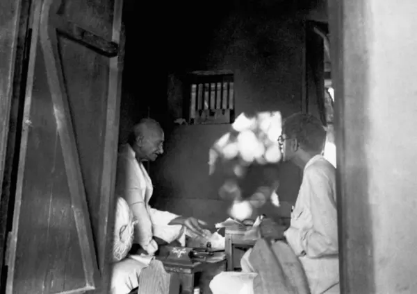 stock image Mahatma Gandhi and Kaka Kalelkar r inside his hut at Sevagram Ashram, 1946  