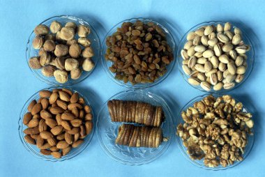 Pistachio; Apricot ; Dry Fig ; Almond ; Walnut and Raisin ; Dry fruits for Diwali Festival ; Deepavali at Borivali ; Mumbai Bombay ; Maharashtra ; India clipart