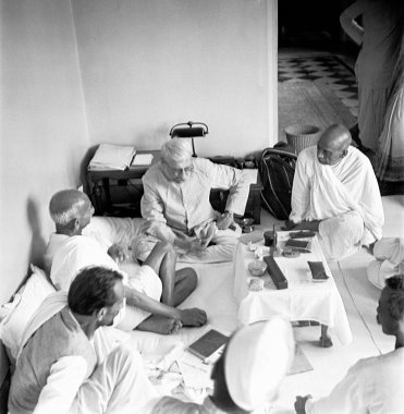 Mahatma Gandhi in discussion with co-workers at Mumbai, Maharashtra, India, 1945 - MODEL RELEASE NOT AVAILABLE clipart