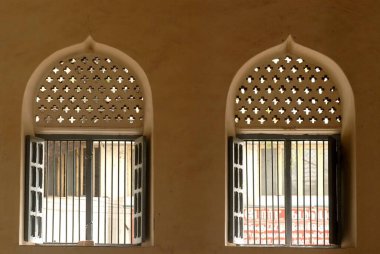 Richly decorated windows of Thirumalai Nayak (Naick) palace built in 1636 in the Indo-Saracenic style at Madurai ; Tamil Nadu ; India clipart