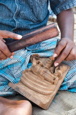 Chiselling wooden sculptures at Karaikudi, Tamil Nadu, India  clipart