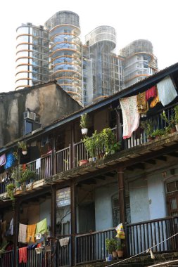 Old chawl daruwala and skyscraper, Ganpatrao kadam marg, Lower Parel, Bombay Mumbai, Maharashtra, India 26-August-2009  clipart