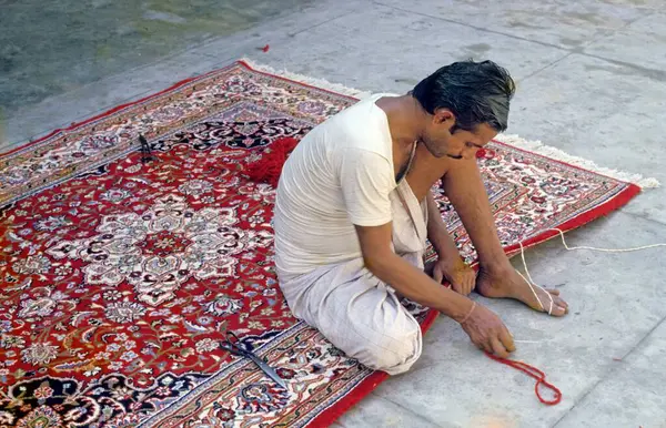 stock image Man making Carpets in Handicraft market   