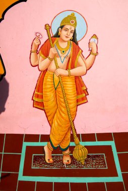 Macebearer or doorkeeper colourfully painted at entrance of Shree Kasba Ganpati temple very old wooden structure ; Pune ; Maharashtra ; India clipart