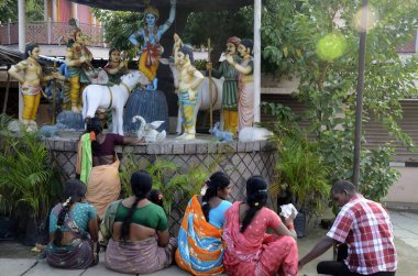 Women sitting temple of Krishna Rajahmundry Andhra Pradesh India  clipart