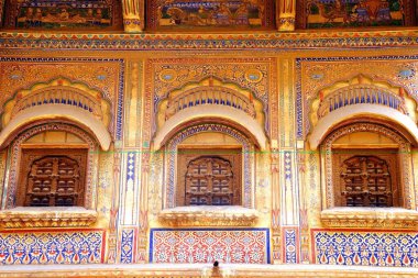 Windows and painting of haveli ; Fatehpur Shekhavati ; Rajasthan ; India clipart