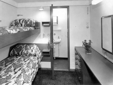 old vintage 1900s black and white picture first class two berth cabin with toilet on passenger ship India  clipart