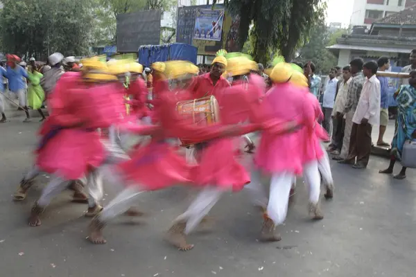 stock image Adivasi from Mokhada performing tribal dance during the religious procession at Court Naka, Thane, Maharashtra, India 