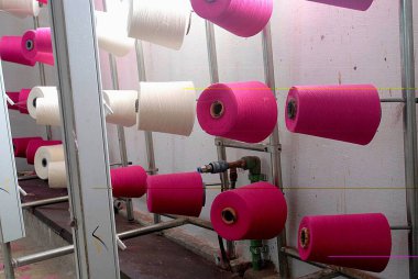 Knitting in a garment industry ; Tirupur ; Tamil Nadu ; India clipart