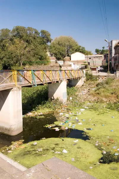 stock image Pollution, river turns into garbage dump, people throw rubbish in river kahr at Saswad village, taluka Purandar, district Pune, Maharashtra, India  