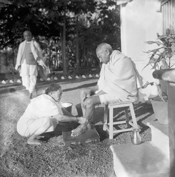 stock image Kasturba Gandhi washing Mahatma Gandhis feet at Bardoli, 1939, India   