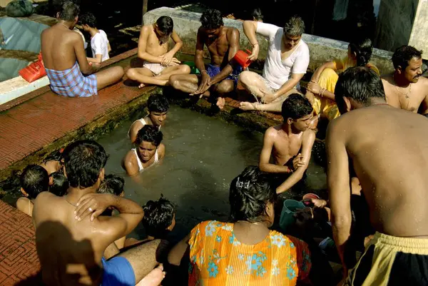 Stock image People enjoying bathing in hot water spring at Akloli near Vajreshwari, Maharashtra, India, Asia 