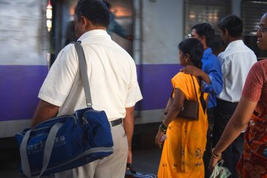Commuters waiting to get into local train on platform of Borivali station ; Bombay Mumbai ; Maharashtra ; India clipart